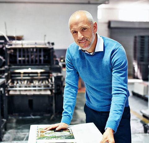 A man working in a printing studio